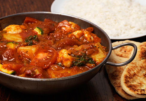 Heaton Balti Stockport sizzling spicy chicken balti dish served with naan bread